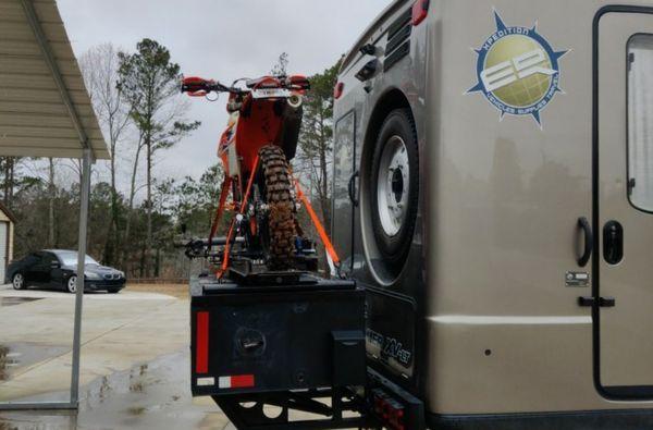 Custom motorcycle mount for a Earth Romer Motorhome.