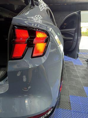 Tail-light tint. First one has tint second one doesn't