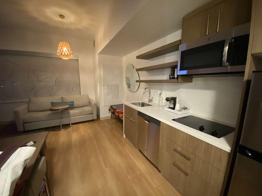 Kitchenette and couch area with a modern vibe.