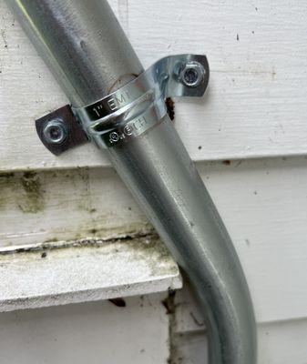 conduit Jammed into the trim adding stress and compromising the integrity of the siding