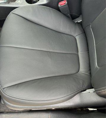 After photo showing repaired leather driver seat.