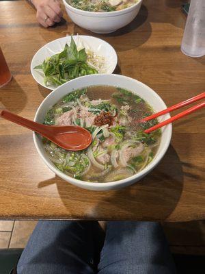 Ribeye Pho (front) and Chicken Pho (back) (the small plate in the middle is the add-ons on the side)