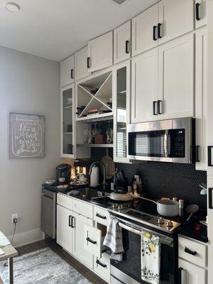 Cabinets galore and a wine rack!