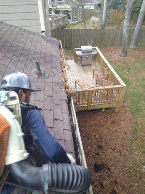 Halfway cleaning gutters