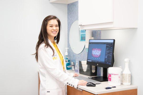 Our orthodontist Dr Kimberly Bui viewing an Invisalign ClinCheck