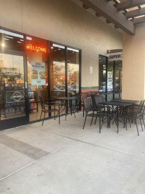 Outside tables in front of the store.