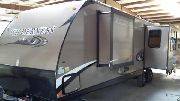 2014 Heartland Wilderness 3175re has 2 slide outs in the living area and 1 closet slide out in the master bedroom.