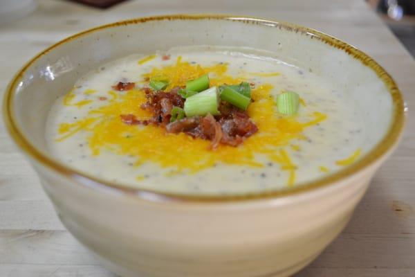 Baked Potato Soup topped with bacon and cheese. Yum!