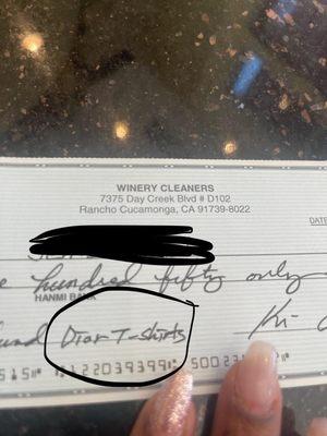 Proof of thievery by owners, they wrote a check for stolen shirt after cops were called.