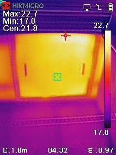 Infrared image of attic hatch indicating leakage and lack of insulation.