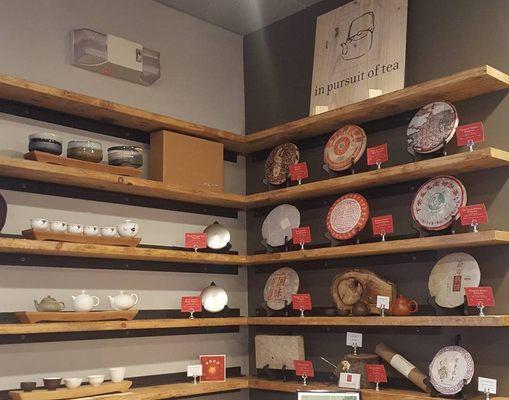 Tea service on the left, pu'er cakes on the right.