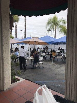 Nice outdoor patio setup!  Takeout booth outside away from people.