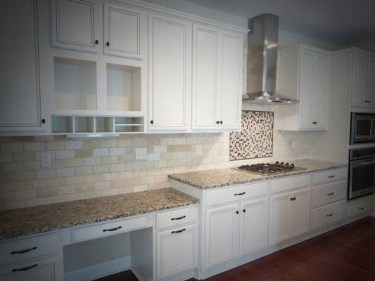 This kitchen has a built in desk/work area