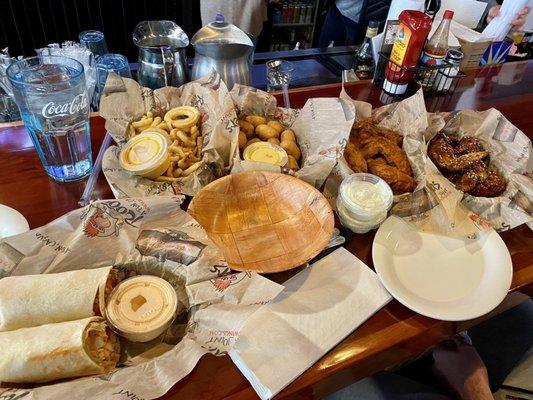 A LOT of food - chicken wrap, wings, curly fries, mini corn dogs