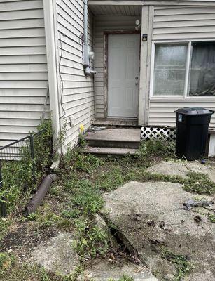 Hole in concrete where it's collapsed.  Says this is a well maintained home.