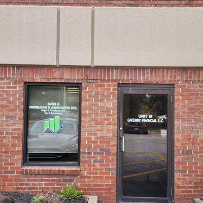 The Ritenour Building at 9821 Olde 8 Road.  Access Suite O through the door marked Unit M Gateway Financial LLC