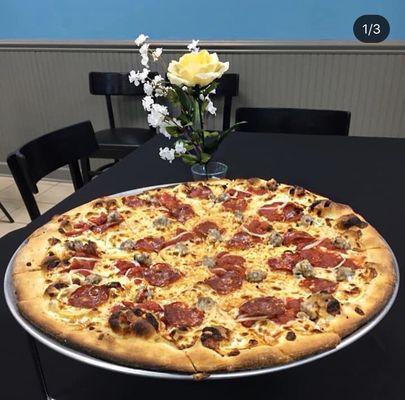 Tomato pie. Well done + thin crust like a tradition tomato pie!