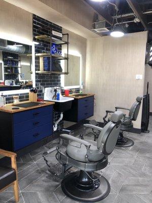 Work station area with gorgeous mirrors and chairs.