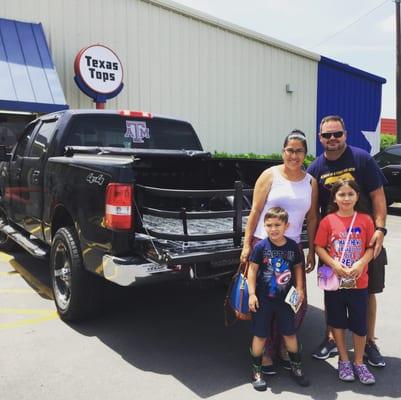 A happy family ready to enjoy their new bed extender.