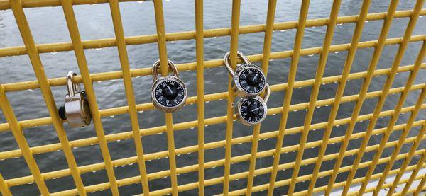 Hundreds of personally inscribed padlocks are on the bridge latticework