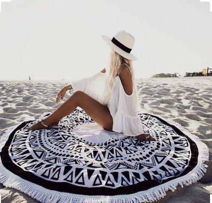 Our Bora Bora Boutique has round beach towels, cover ups and sun hats!