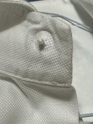 This top button was wholly removed, and no one said anything.