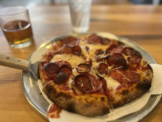 Classic pepperoni and a vanilla smoked Manhattan.