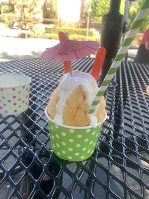 $7 Shaved Ice "Island In The Sun" with flavors of Passion, Orange, Guava, & Haupia Cream