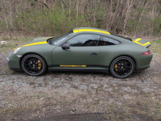 2013 Porsche 911, matte military green wrap with yellow stripe package.