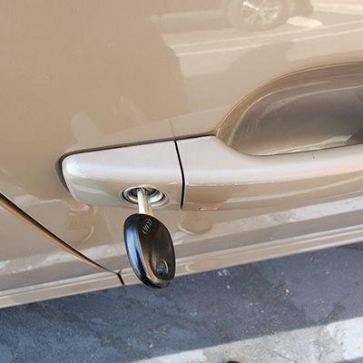 Key stuck in the passenger side door lock cylinder.