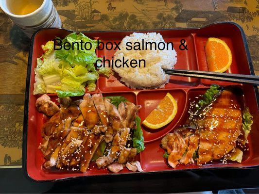 Bento box with salmon and chicken teriyaki.