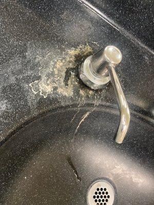 dirty sink with hair stuck to it