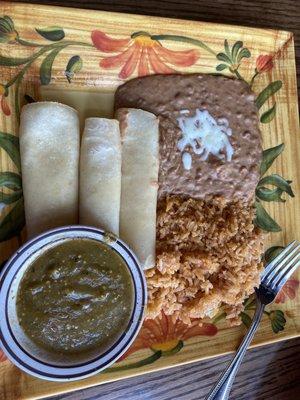 My cheese enchiladas with green sauce on the side, rice, and beans.