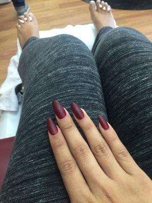 Matte red casket nails.