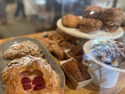 Hidden amongst the pastries is the legend: Almond Croissant.