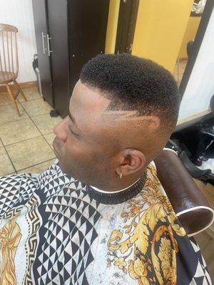 Signature skin tight fade with part razor finish