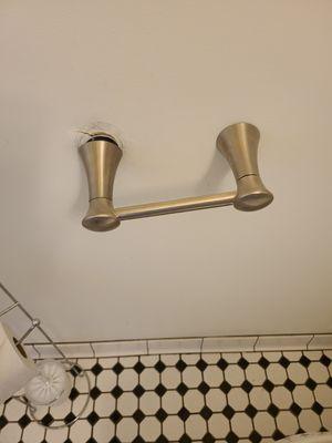 Toilet paper holder coming out of wall