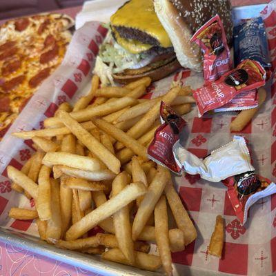 Large portion of fries. Packets of ketchup and mayonnaise.