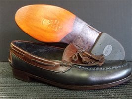 This is a pair of men's shoes that received a new half leather sole, brand new heels and a shoe shine