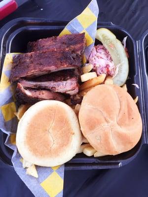 Ribs with French fries! loved the complimentary pickle, coleslaw, & roll that was toasted & buttered! worth the $14.50