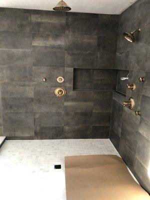 Residence black porcelain tile on shower walls