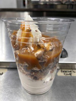 Soft serve vanilla topped with Caramel & Twix