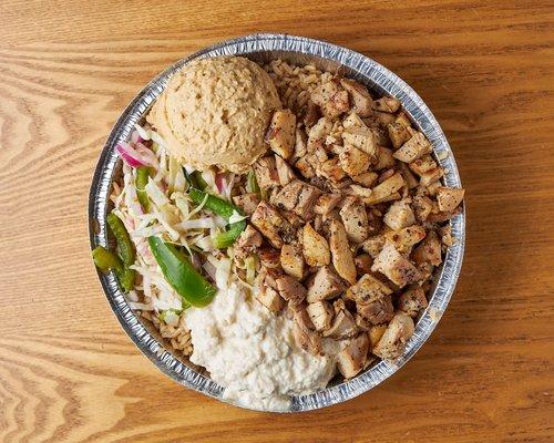 #10 Salt and pepper chicken over brown rice w. Hummus, babaganoush, health salad, and lemon tahini sauce