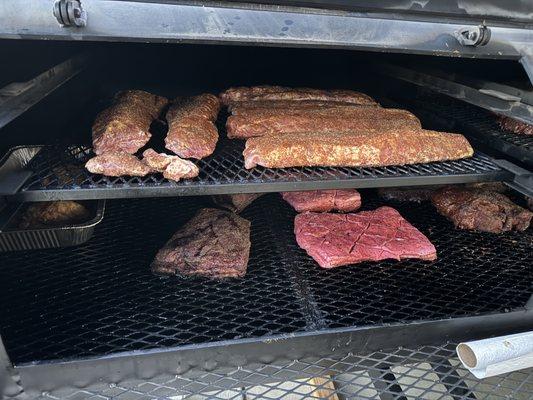 Our 500 gallon trailer smoker in action. Book us for your event