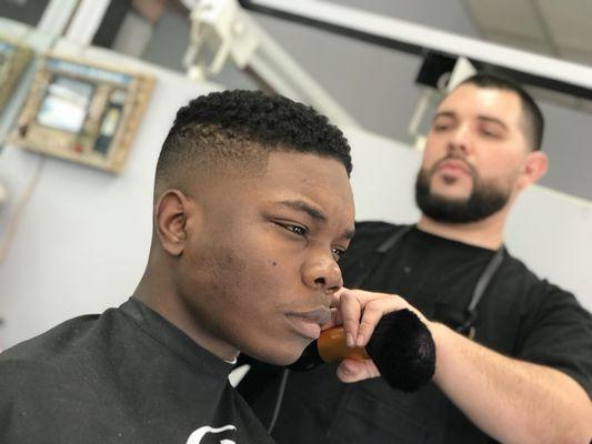 Eric creating a beautiful skin Fade, $30