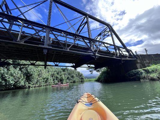 Under the bridge.