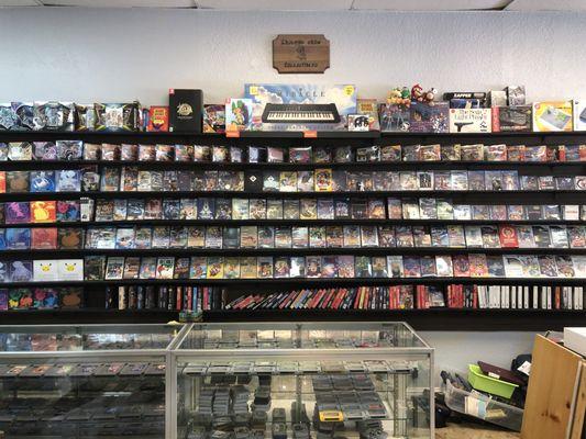 More video games in the counter display and behind the counter on the wall.