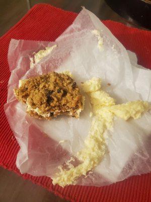 Partially eaten cookie sandwich- oatmeal raisin with filling