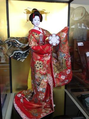 This beautiful doll is available only at Hosekibako. It stands about 25" tall and case is 29" tall.