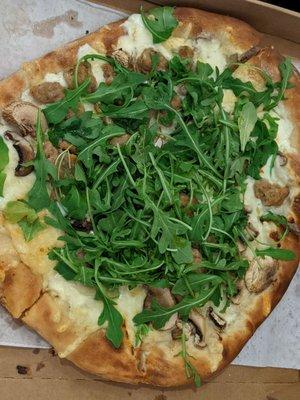 Mushroom pizza with fennel sausage added